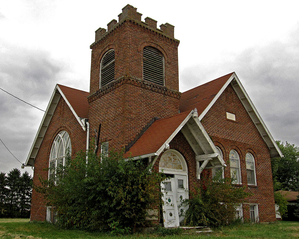 Located on the corner of Pole Lane Road and Likens Road, this church, known by many as Likens Chapel, dates to 1917 and replaced the original church that stood at this location. During WWII, the US government took much of the land in that area for the Scioto Ordinance Plant, and the church was forced to close its doors. By 1950, however, church services were once again taking place there. Nevertheless, by the 1980s the congregation had dwindled to such an extent that the church disbanded. Since then, the church has generally stood empty (though at one point a family was using the church as a private residence).