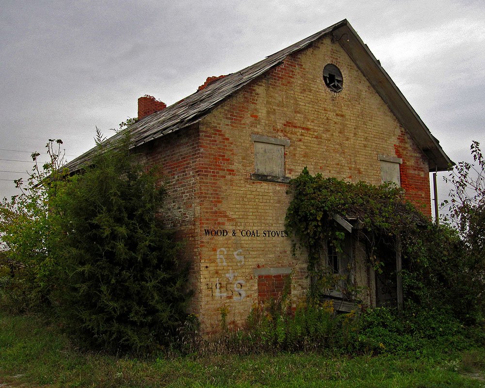 According to Willis Thomas' book The Schools of Marion County, Ohio, this building, located near the intersection of Marion-Bucyrus Road and Morral-Kirkpatrick Road, was once known as the "Hill School" and dates to at least 1869. The school was later owned by the Mitchell family, and they ran various businesses (e.g. repairing chainsaws, selling wood-burning stoves) out of it for years.